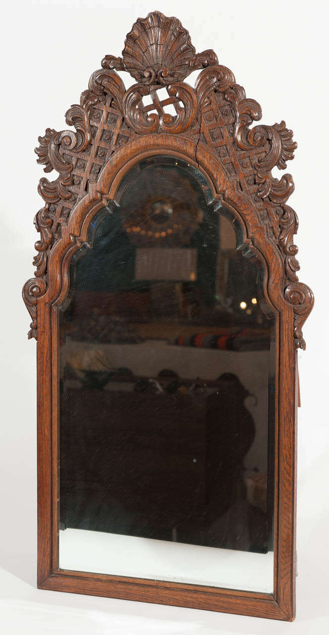 Diminutive highly patinated carved oak mirror frame in the style of Louis XV.  Liege origins.