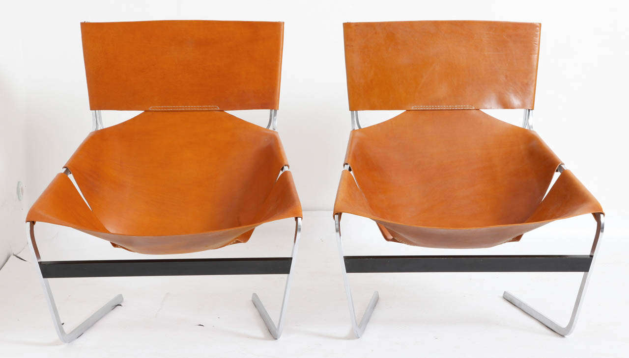 Pair of seat F444 designed by Pierre Paulin for Artifort in 1963. 
The chromed metal frames are in good condition. The cognac leather has been new upholstered, according to the original.