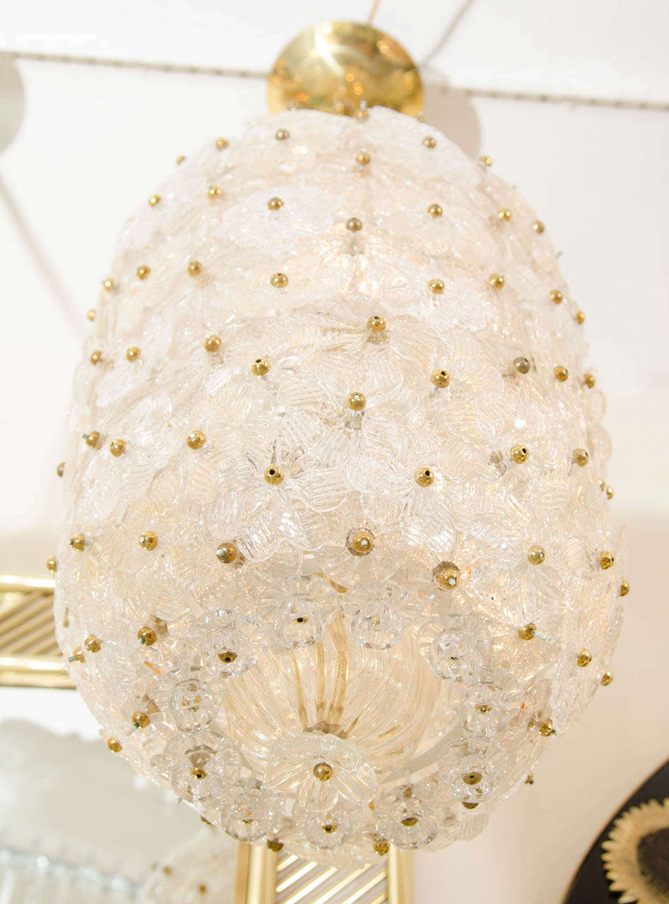 Vespiary shaped pendant ceiling fixture with applied golden glass flower elements by Barovier.