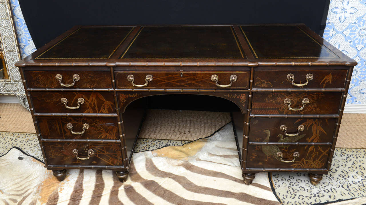 Chinoiserie style desk and console table,Elaborately lacquered with gilt and polychrome decoration, with a leather top and resting on turned feet. Together with an elaborately lacquered table with gilt and polychrome decoration. ...