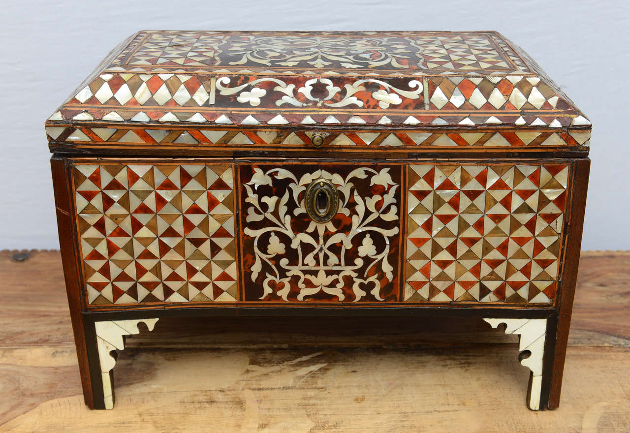 A 18th c. Turkish Mother of pear inlaid chest inlaid throughout to show foliate scrolls and geometric forms, raised on four legs.
From the 16th century onwards the dominant influences in Islamic woodwork were those of the Ottoman Turkish empire