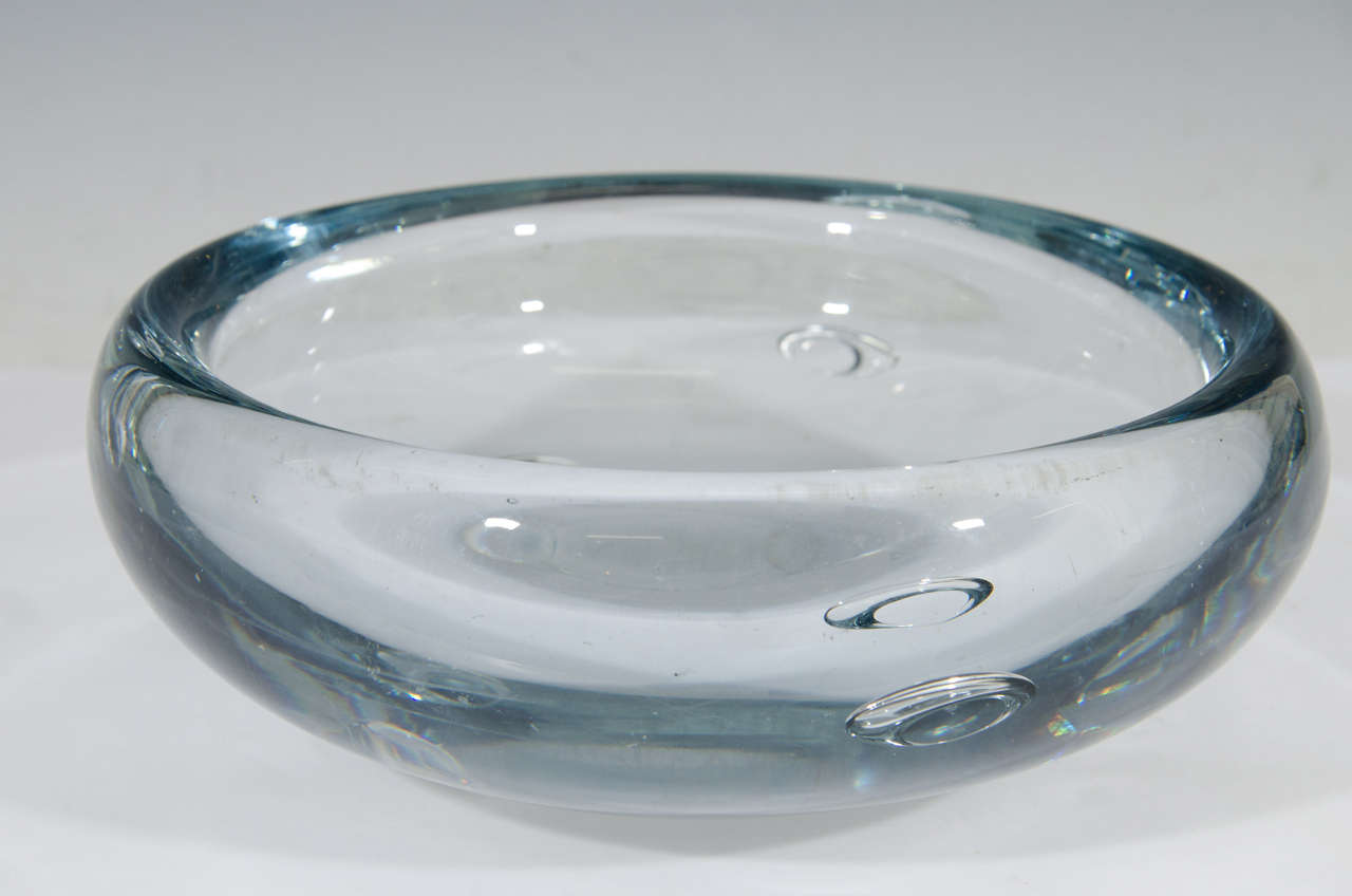 A vintage art glass Swedish dish or bowl in blue-grey, produced circa 1950s-1960s. Good condition, with age appropriate wear.