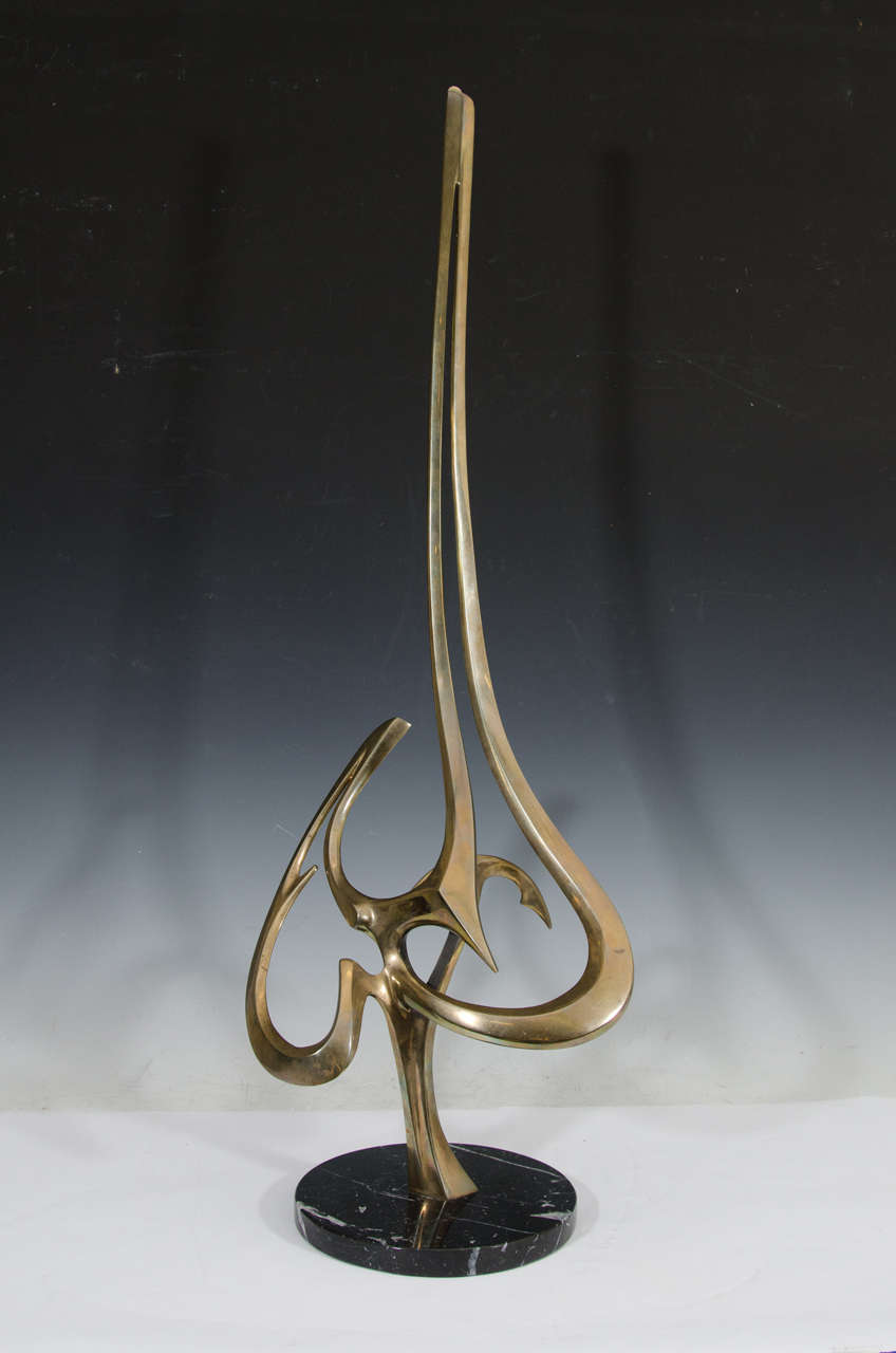 A vintage tall abstract bronze sculpture on a marble base by American artist Bob Bennett. Signed, dated (1985), and numbered (36/100) at the back base.

Bennett sculpture is created by world-renowned sculptors Bob and Tom Bennett, identical twins