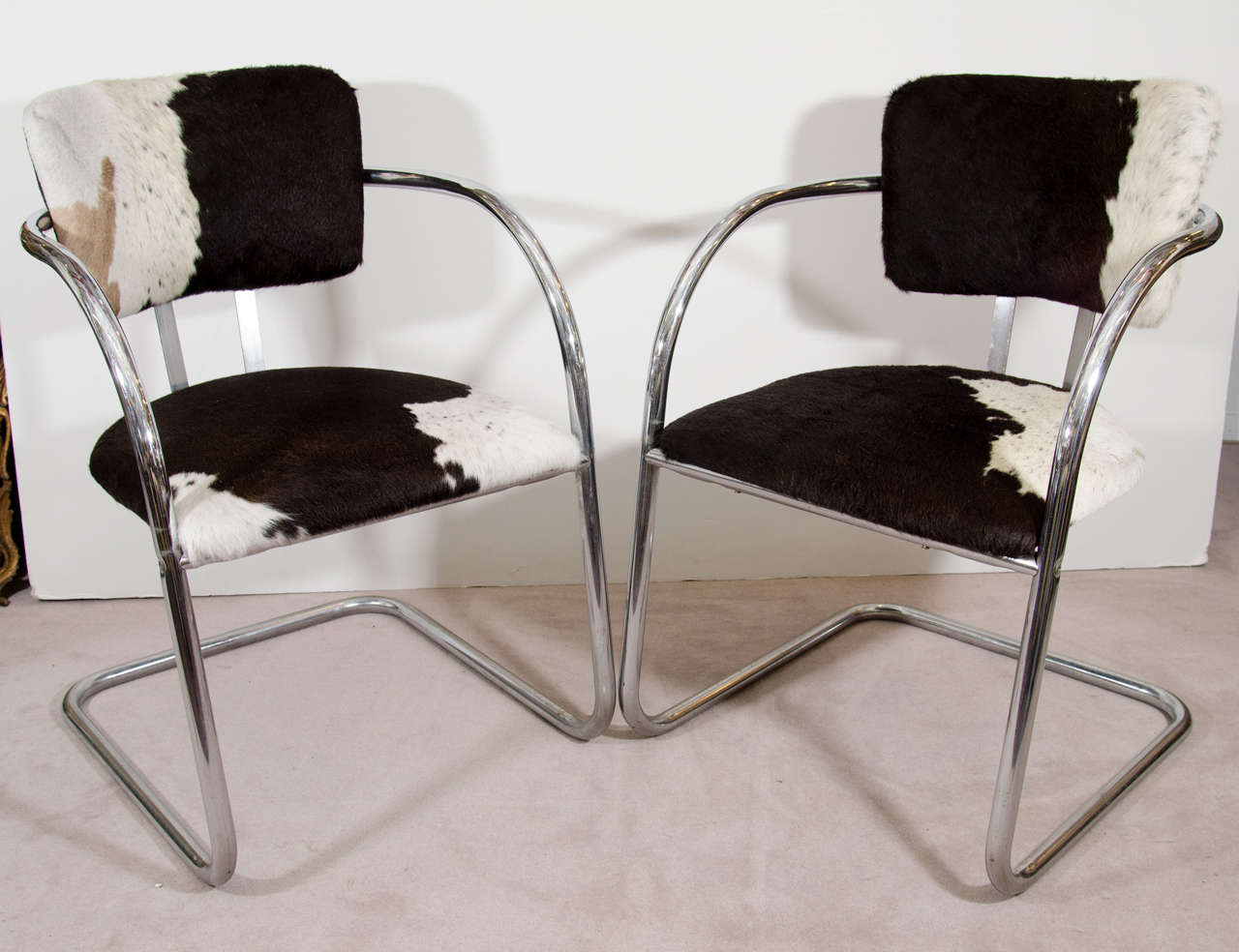 A 1930s pair of KEM Weber chairs with chrome frame. Newly upholstered in cowhide.