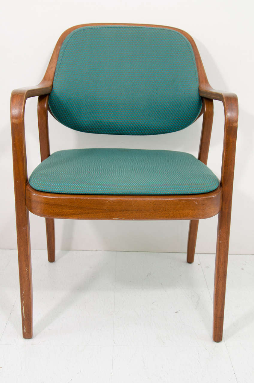 A vintage set of 13 Knoll model #1105 bentwood chairs with original teal upholstery designed by Don Pettit. Five of the chairs retain their Knoll International paper labels on the bottom. These chairs can be used as side chairs, dining chairs or