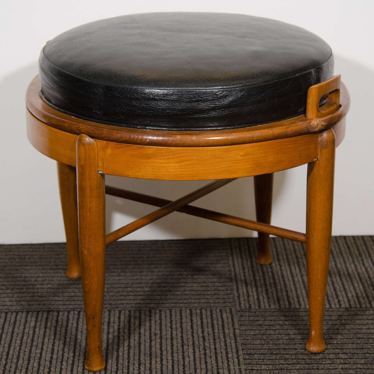 A vintage two-part teak stool with black leather cushion that converts to a side or occasional table by BJ Hansen for Mobler.

Good vintage condition with age appropriate wear.