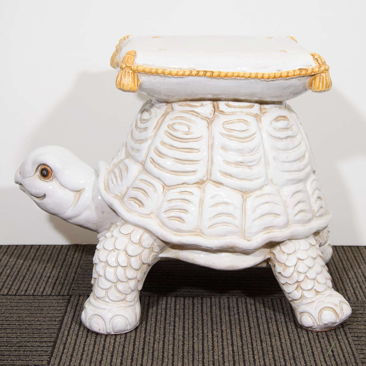 A vintage whimsical Italian ceramic garden seat in the shape of a turtle. 

Good vintage condition with age appropriate wear.