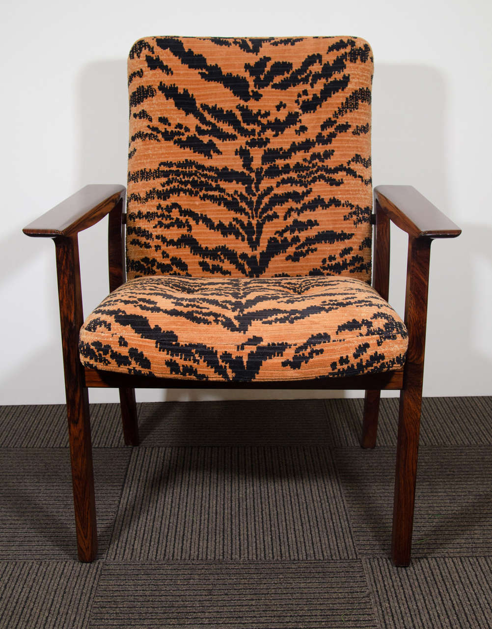 A vintage pair of rosewood armchairs or side chairs reupholstered with vintage tiger velvet upholstery, circa 1950s.