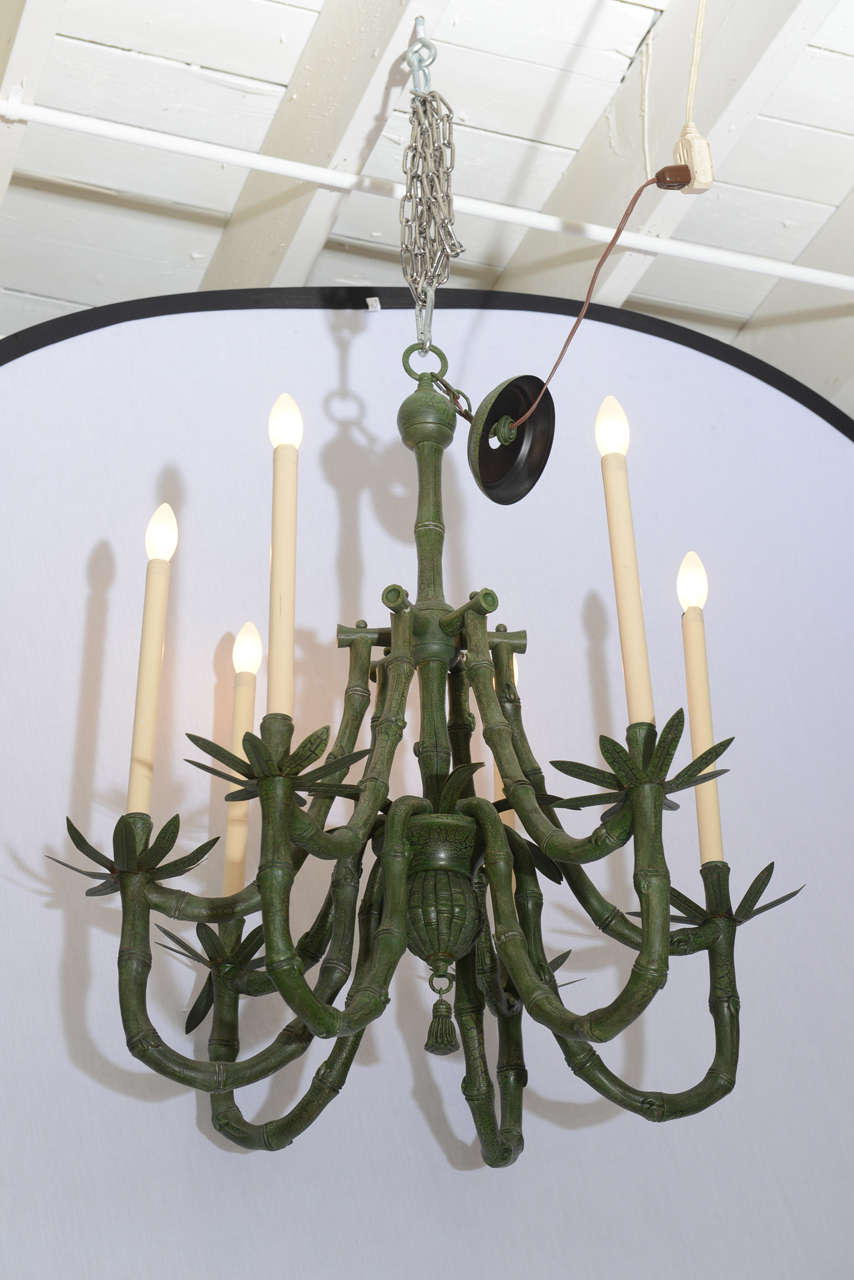 A Classic Hollywood Regency chinoiserie chandelier with original finish. This piece is in excellent all original excellent condition. Exact age is unknown I am estimating late 1960s-early 1970s.