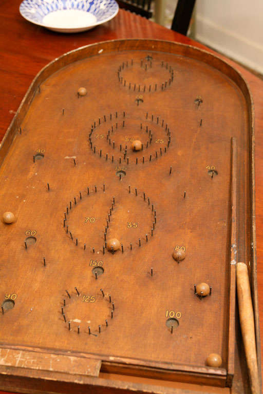 This vintage antique game is a folk art piece. Painted Porch collects antique toys and games and we always display them to be used as a piece of art. in this case , to sit on a table or hang on a wall. it is in good condition and simply a