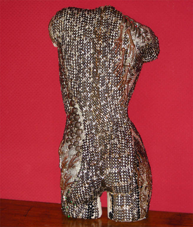 2000 half-torso seen from the back by  Frédérique Lombard Morel, in metal and silver metal.