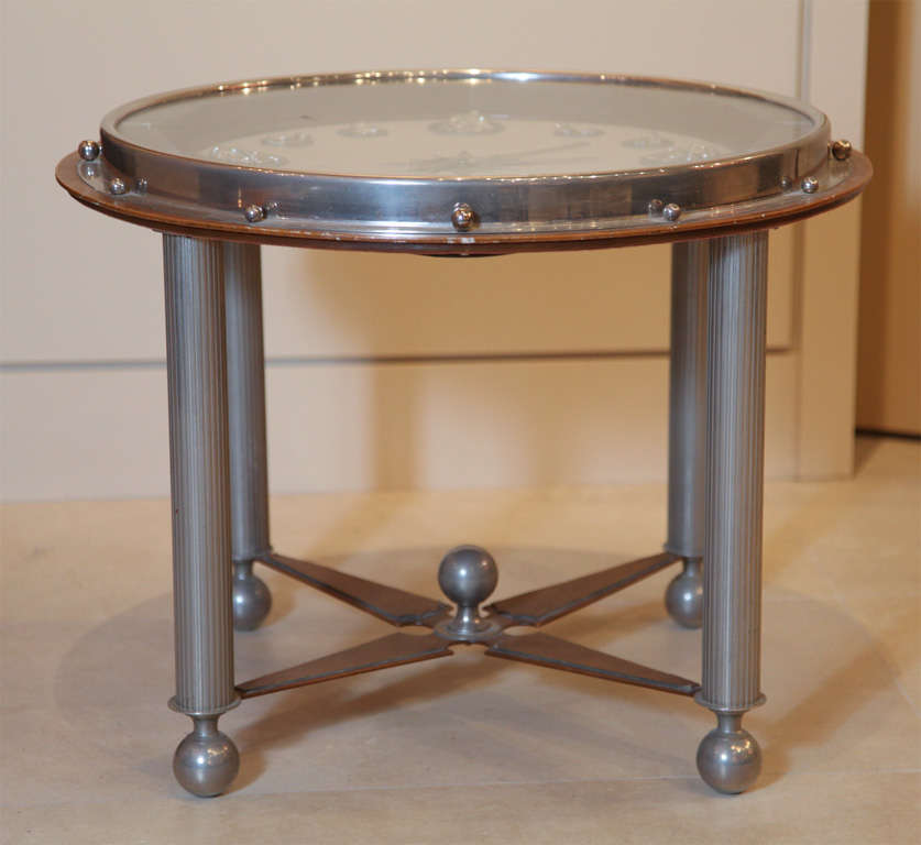 Clock faced side table by Jacques Adnet with leather details.