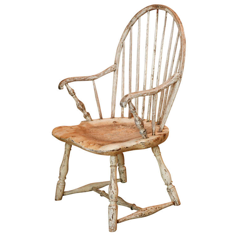a white painted and scrubbed windsor chair with shortened legs to boot.
perfectly useable and super comfortable.