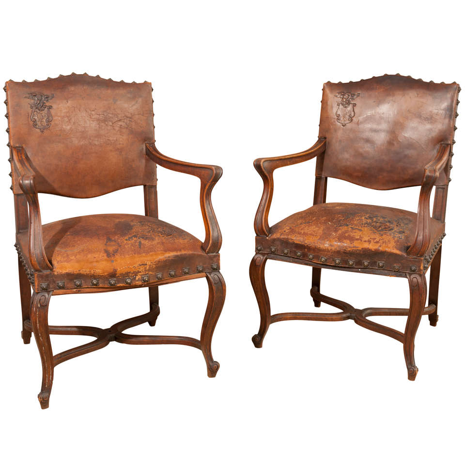 Pair of 1920's leather  armchairs 