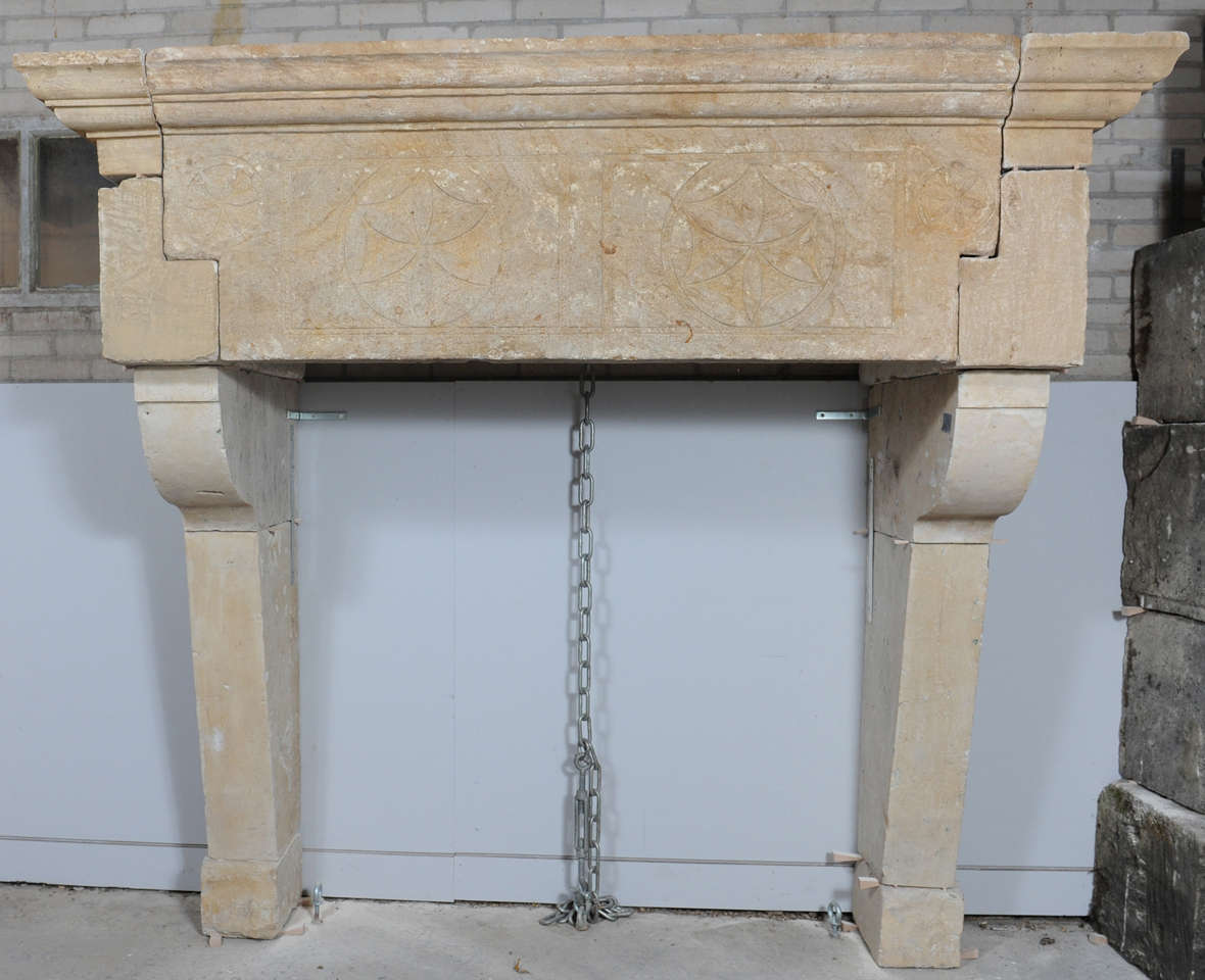 A 17th century east-French limestone castle fireplace/mantle piece.