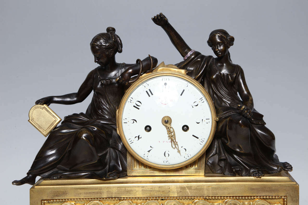 Gilt A Louis XVI Period Antique French, Patinated and Dore Bronze Mounted Figural Clock For Sale