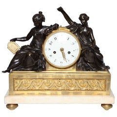 A Louis XVI Period Antique French, Patinated and Dore Bronze Mounted Figural Clock