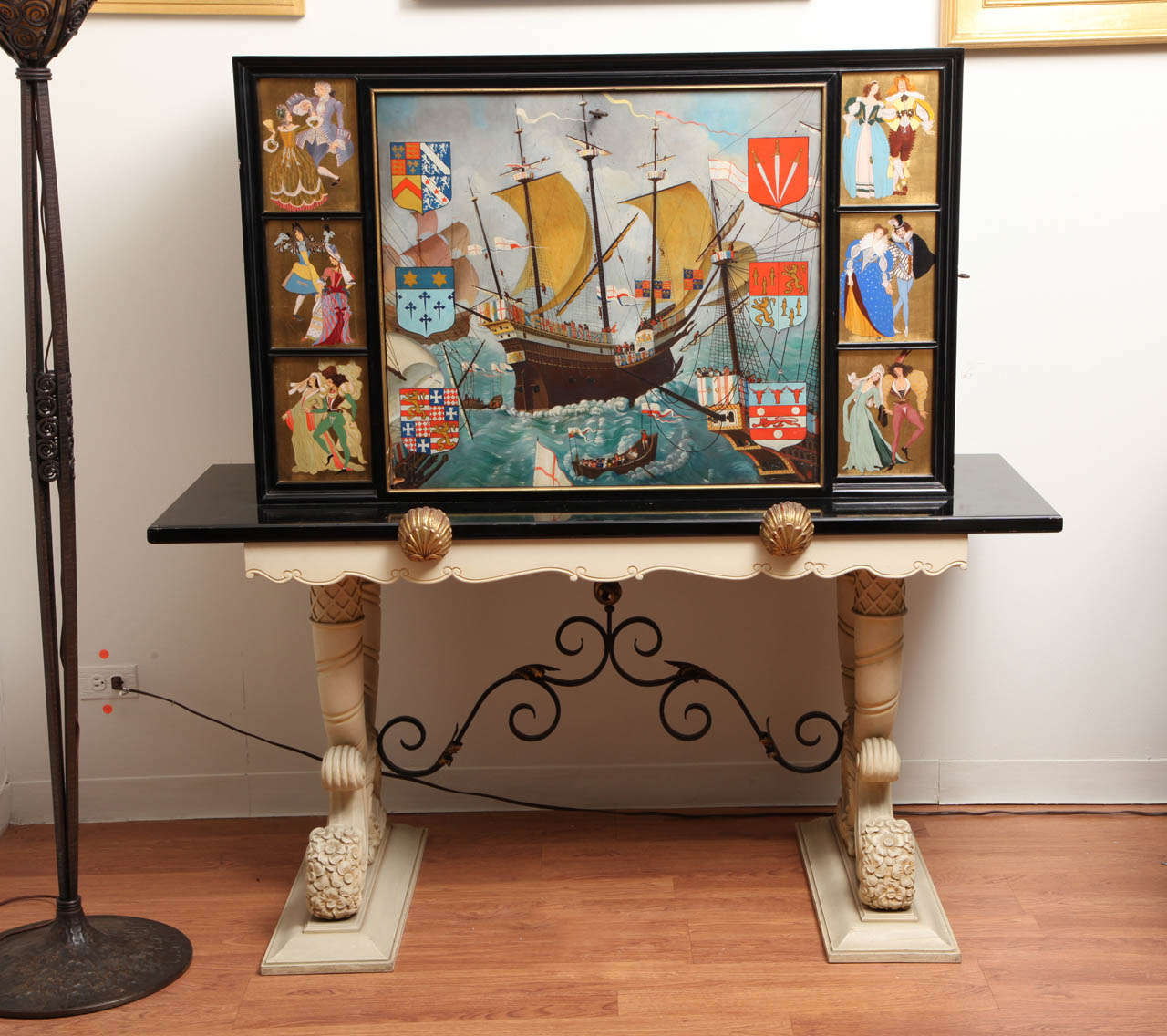 1940s bar cabinet in Renaissance Revival style, with polychrome hand-painted decoration on black lacquered wood, depicting a naval scene with coat of arms symbols and the corresponding ladies and knights dressed in different styles of fashion. The