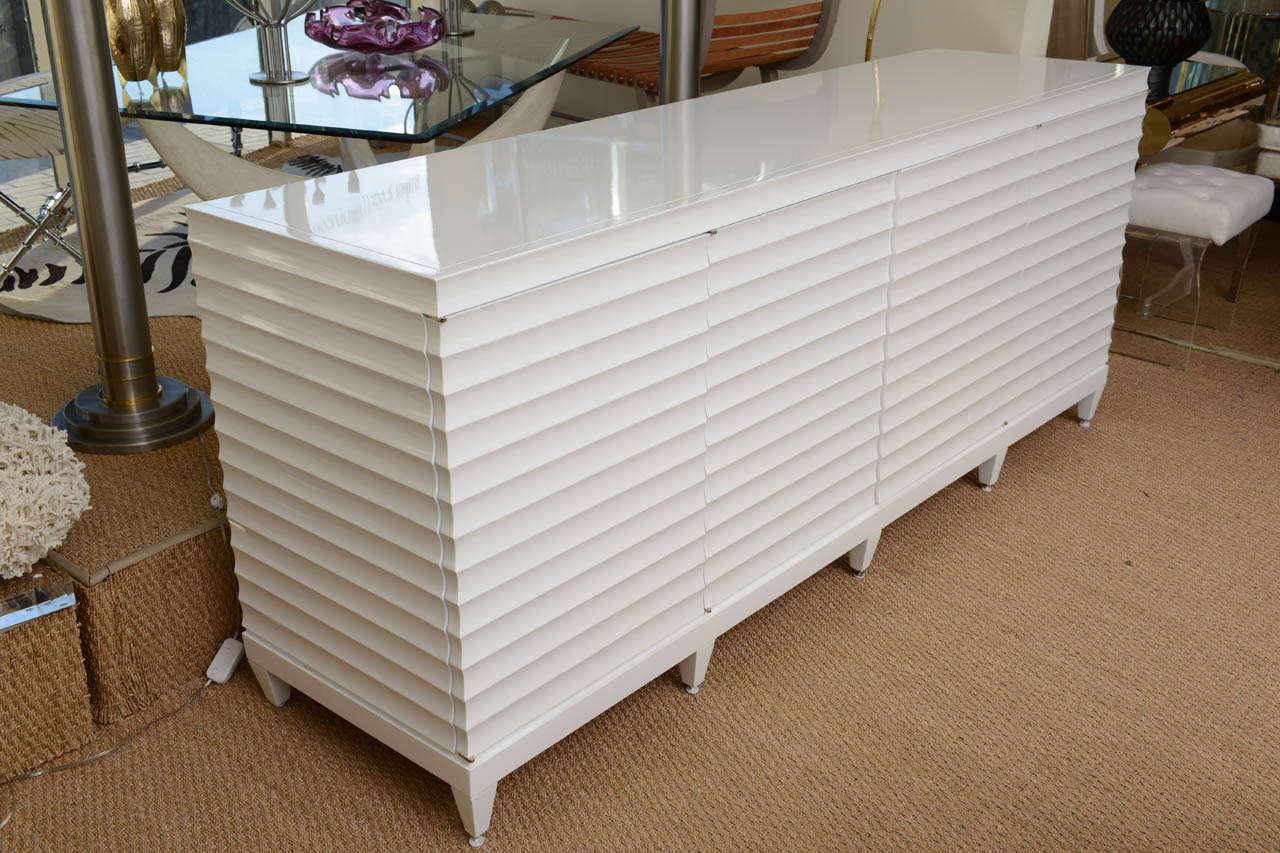 This sculptural fluted freshly white lacquered buffet/cabinet/dresser/ is versatile and has a great look!
it is clean and modern and very versatile!

It has a taller height than most.

NOTE: THIS WILL BE ON THE SATURDAY SALE FOR 1 WEEK ONLY