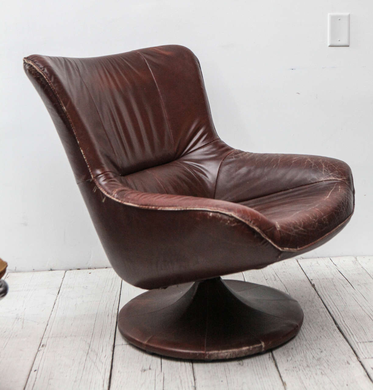 Leather wrapped swivel chair.