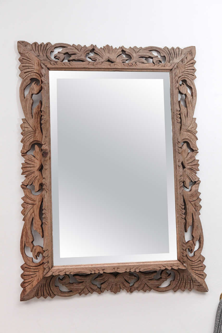 Renaissance revival distressed wood wall mirror.