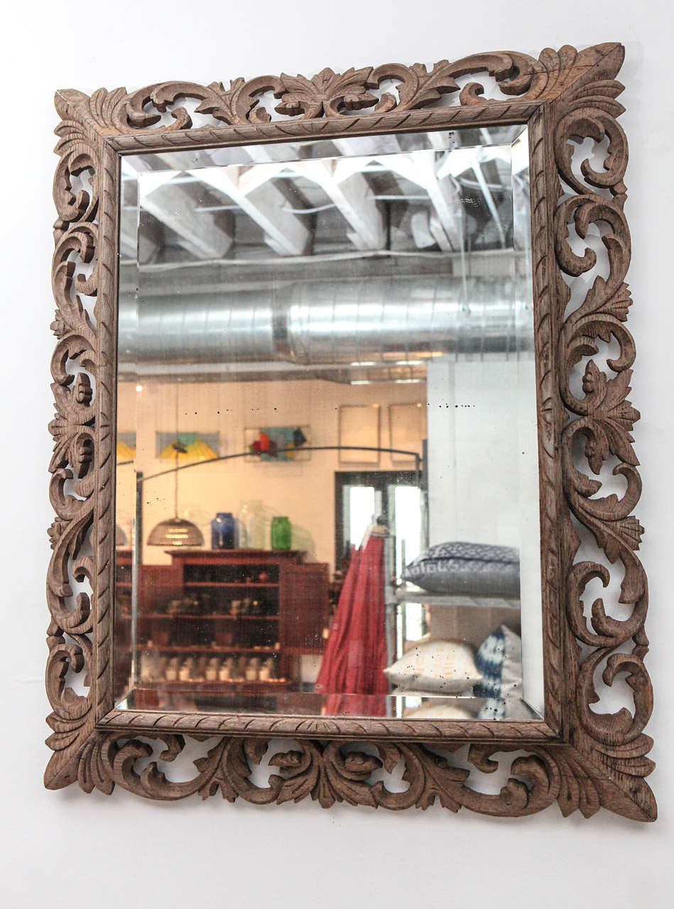Renaissance revival distressed wood wall mirror.