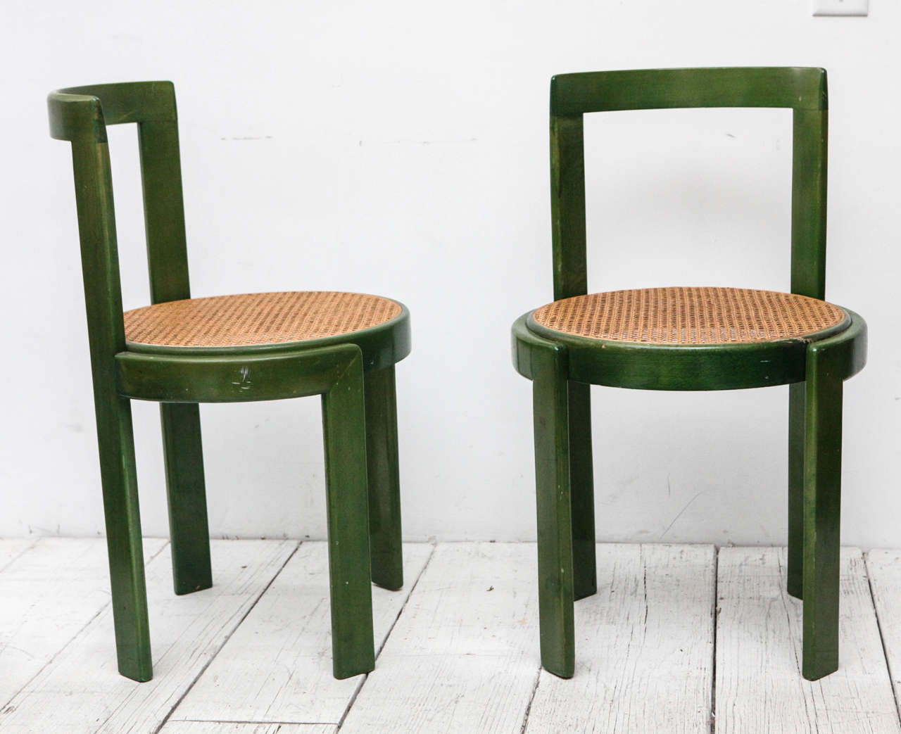 Four beautiful grass-green washed dining chairs with newly restored cane seats.
