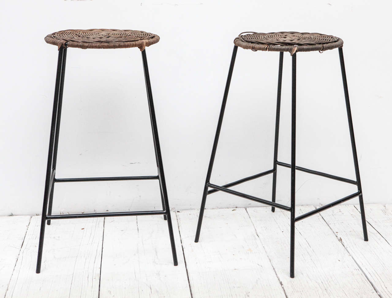 Mid-Century metal and wicker counter height stools. Four available, sold individually.