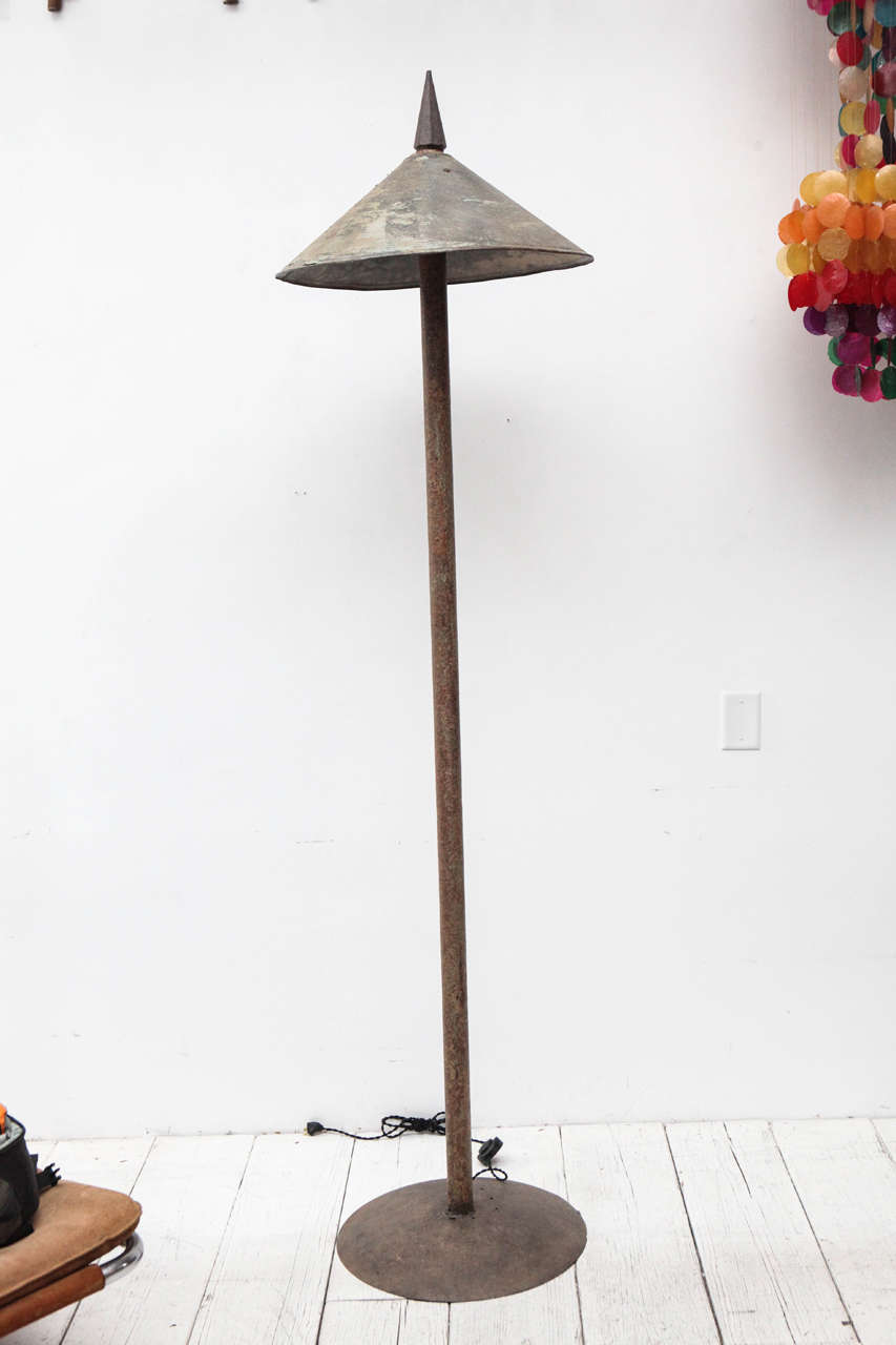 Tall floor lamp with spike and cone shade. Newly rewired.