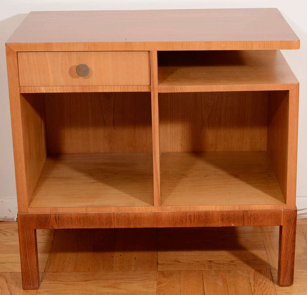 A perfect table for anywhere storage and ease of access is required!  Constructed of fir and golden-toned ash, with walnut-stained top, frame and legs, the compartments offer drawer, shelf and cabinet storage in one compact piece.