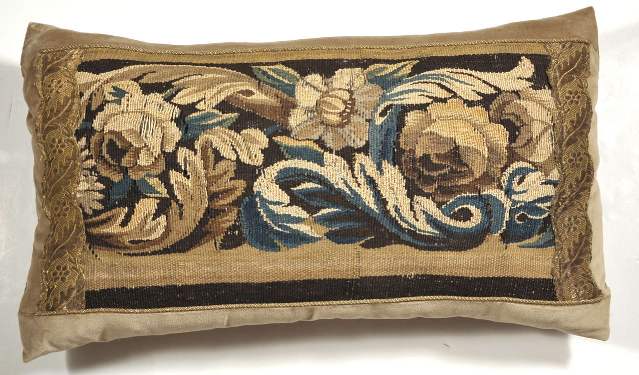 Beautiful florals and leafs are depicted in golds, browns and blues in this pillow. It is made from a 19th century French tapestry remnant and antique gallon ribbon on velvet. Custom-made by us with to the trade fabrics. Down filled.