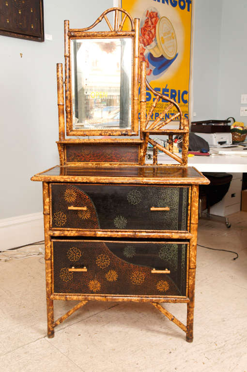 English lacquer and bamboo  2 drawer Victorian dressing table.
Flower motif decoration and beveled glass mirror.