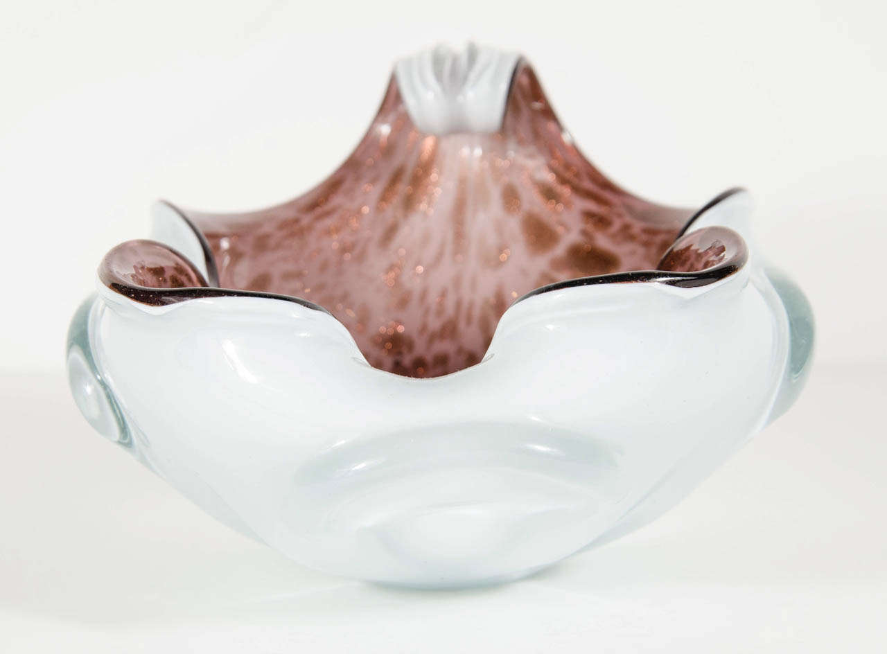 This stunning organic free form bowl features a rich aubergine murano glass with an off white exterior with murano glass decorative swirl and 24k gold accents.