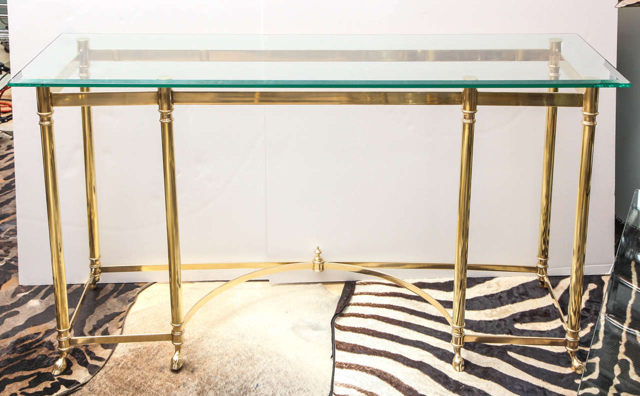 Decorative brass console with beautiful detailed legs.