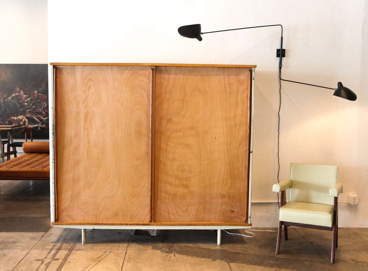 Armoire has three adjustable shelves and interior hanging rack. This is the largest size armoire produced by Ateliers Jean Prouvé.