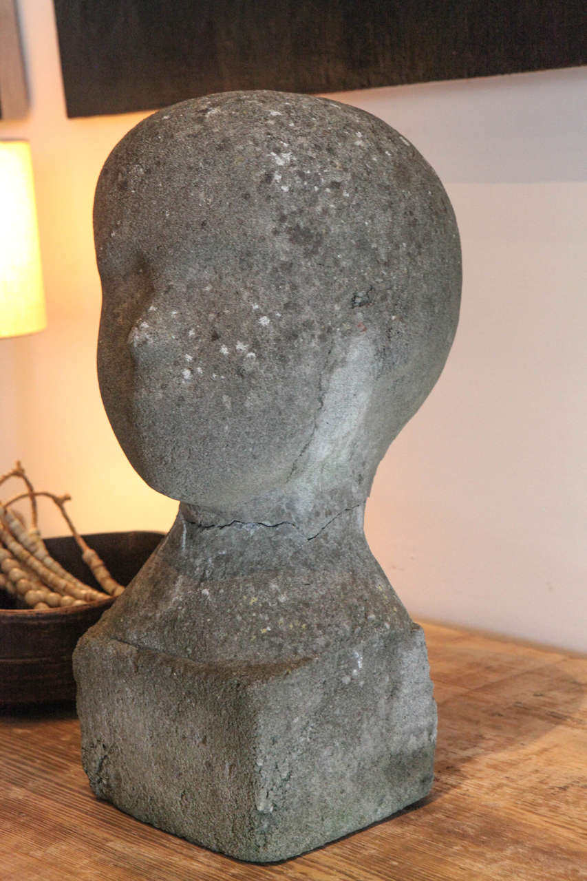 Concrete head of a boy, head separates from base and fits together like a tight puzzle piece.
Once attached is more than secure. Svend Wiig Hansen (1922-1997).