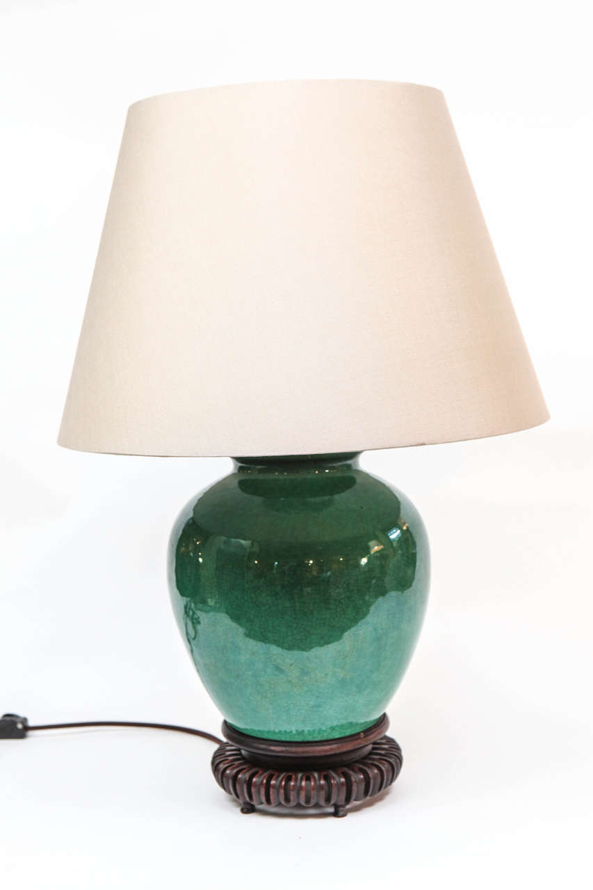 A Chinese Green Crackle Glazed Jar, c. 1840,
now mounted as a Lamp with a Custom Silk Pongee Shade in Dark Natural.