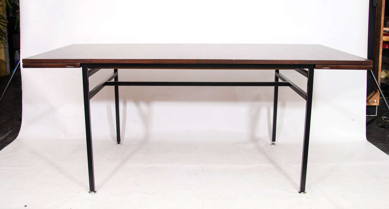Very handsome and beautifully detailed dining table with two foldout extensions. This is model number 802 from Alain Richard's Meubles TV series. Each extension measures 11.75. Please contact for location.