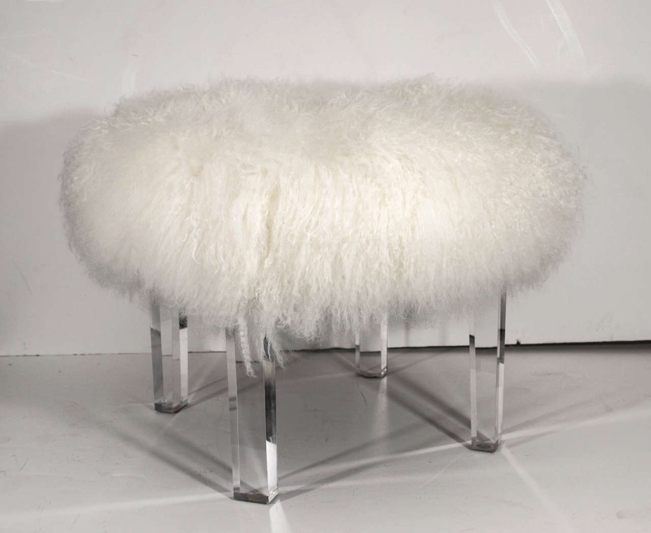 Hand-dyed fluffy Tibetan lambswool on Lucite legs.