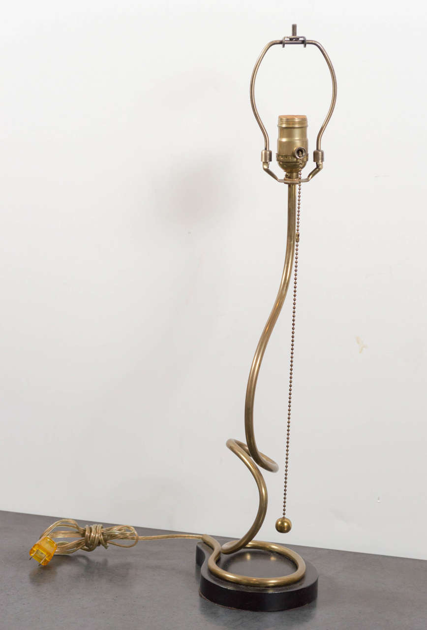 Extremely stylish brass and wood table lamp.