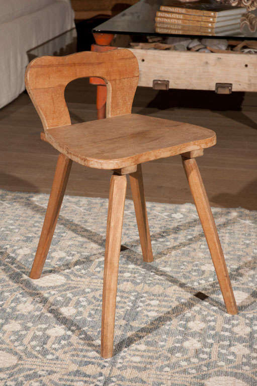 Charming petit wood stool with lovely rustic details.
