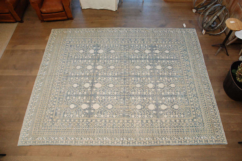 Stunning pale blue, cream and tan rug.
