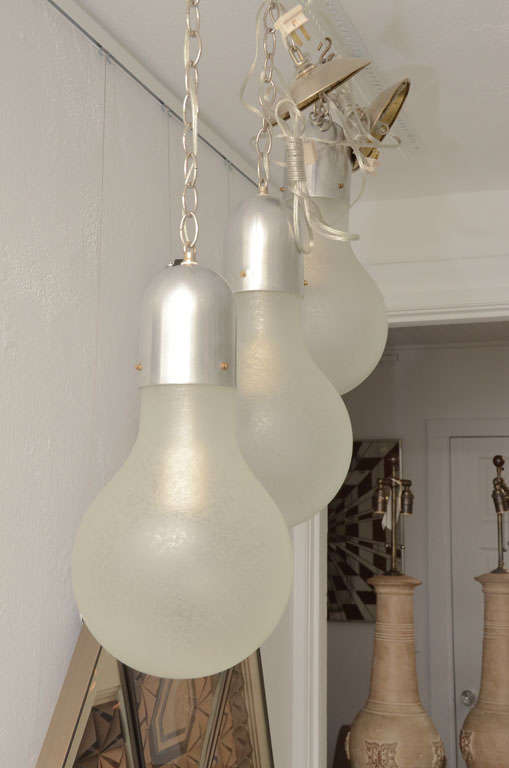 Frosted glass light bulb ceiling light fixture.