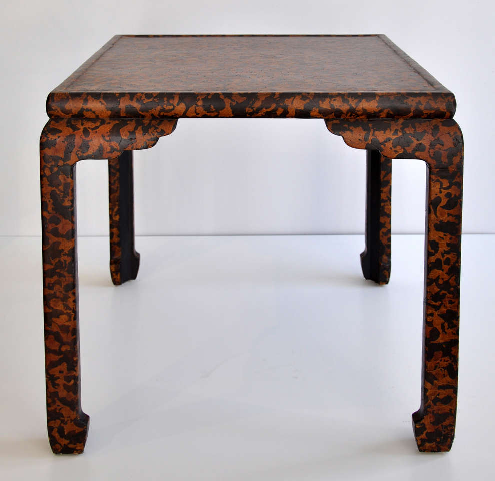 Oriental style side or game table by Baker Furniture with an interesting, rich craquelure  faux animal print finish. Original condition, retains Baker Furniture label.  Might have been a custom design.