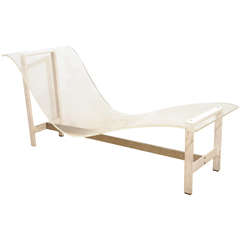 A Lucite and Steel Travail Chaise Longue