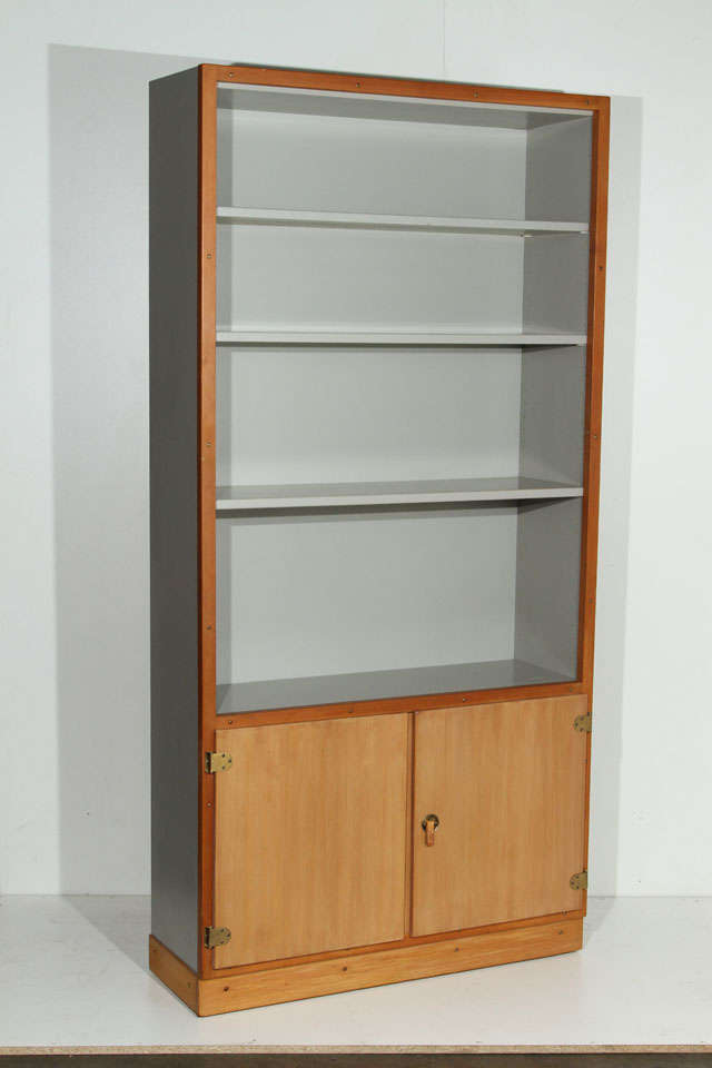 Pair of Grethe Meyer and Børge Mogensen bookcase in gray or blue painted wood and Oregon pine from 'Boligens Byggeskabe' series with adjustable shelves. Base has stitched leather tab hardware and exposed brass hinges. Designed and manufactured