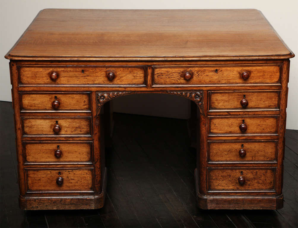 19th century English oak partner's desk with drawers on opposite sides.