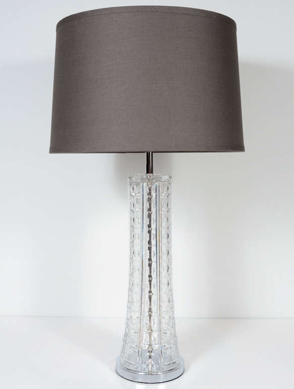 This gorgeous pair of lamps feature a base of tapered design of cut crystal with a cross hatch design  with convex circular cut detailing. They are fitted with chromed fittings and have been completely rewired and also have custom shades as well.