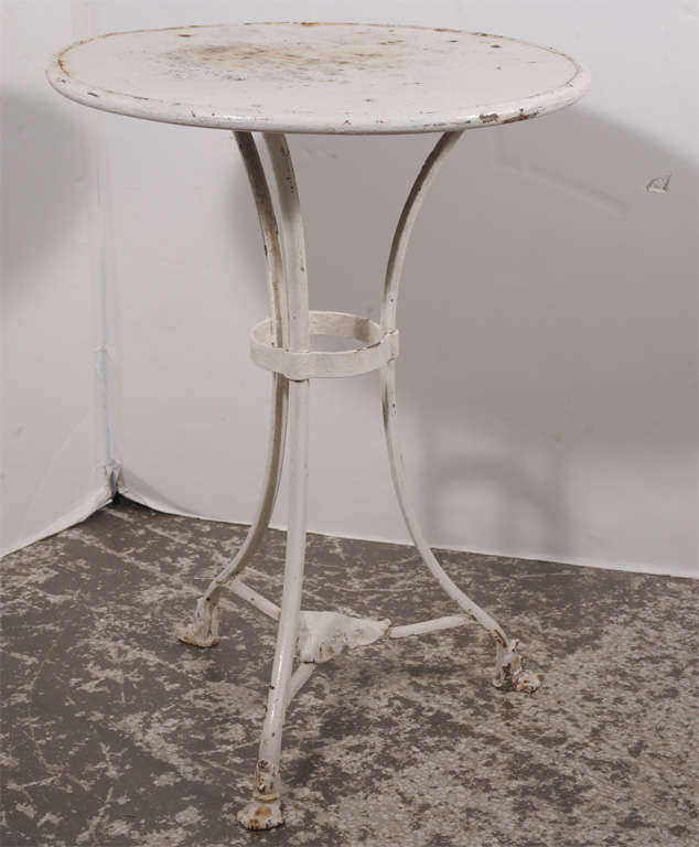 Small scale iron garden table by French
maker Arras, old white paint.
