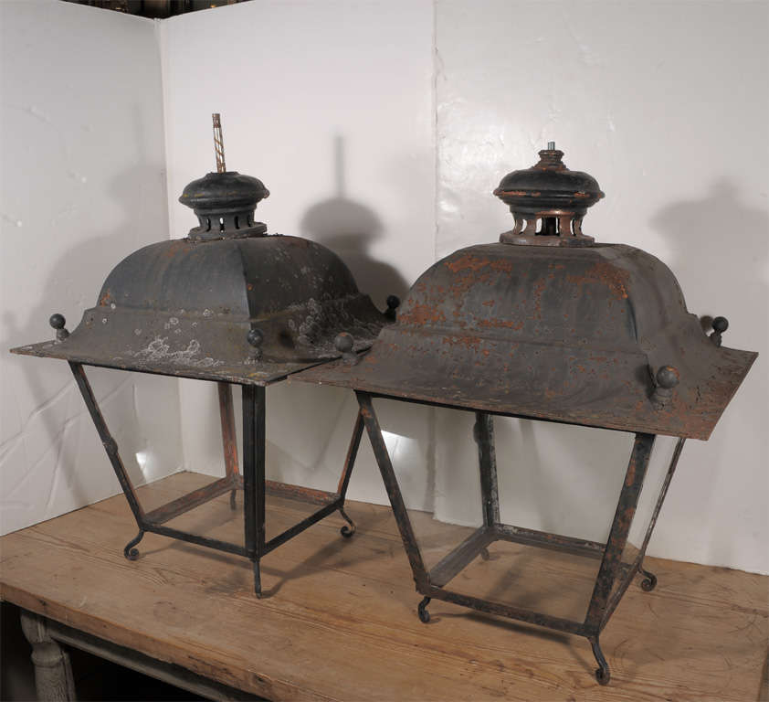 Large iron lantern from a stable in France. Has old black paint and copper cap..